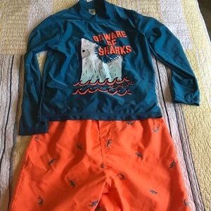 Boys Size 8 swim trunks plus two rash guards